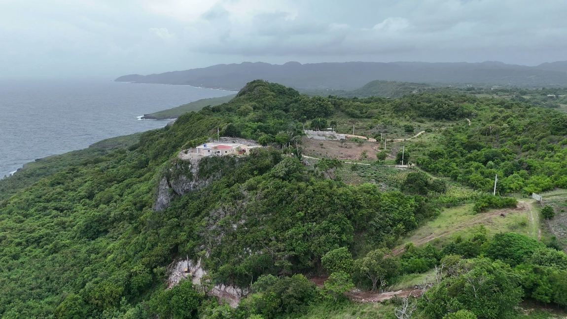The colonial casa on the headland, from the air